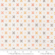 a fabric with a repeating pattern of orange and gray flowers, with small orange dots scattered throughout the fabric.