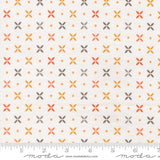 a fabric with a repeating pattern of orange and gray flowers, with small orange dots scattered throughout the fabric.