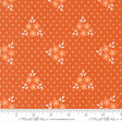 a repeating pattern of orange flowers with white leaves against a background of small white dots.
