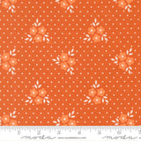 a repeating pattern of orange flowers with white leaves against a background of small white dots.