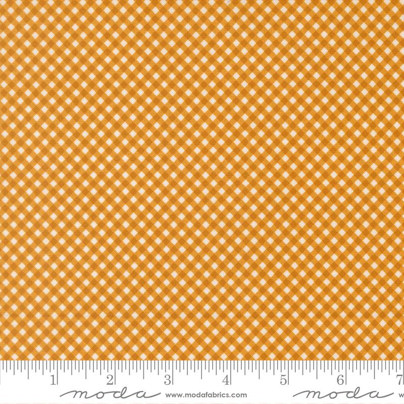 a close-up view of a fabric with a repeating pattern of small white squares arranged in a diagonal grid. The fabric appears to be made of a material with a checkered or gingham-like design.
