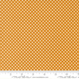 a close-up view of a fabric with a repeating pattern of small white squares arranged in a diagonal grid. The fabric appears to be made of a material with a checkered or gingham-like design.