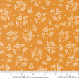 a fabric with a repeating pattern of white flowers and leaves on an orange background. The pattern is spread across the fabric, creating a visually appealing design.
