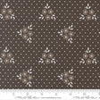 a fabric with a brown floral pattern and white polka dots.