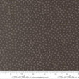 a close-up view of a fabric with a dark brown color and small white dots or specks covering the entire surface.