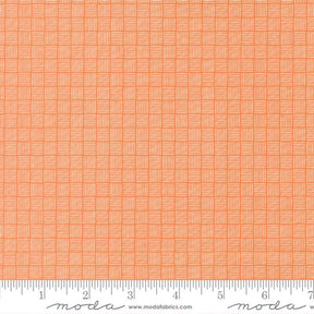The image is a close-up of a fabric with a repeating pattern of orange squares arranged in a grid-like fashion.