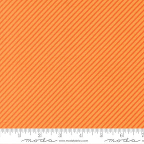 The image is a close-up of a fabric with a diagonal striped pattern in shades of orange and yellow.
