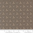 The image is a fabric with a repeating pattern of brown flowers and white stars. The pattern is evenly spaced across the fabric, creating a visually appealing design.