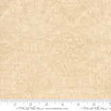 The image is a fabric with a repeating pattern of cherubs and flowers, with a ruler for scale.