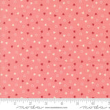 a fabric with a repeating pattern of small hearts in shades of pink and white. The pattern is spread across the fabric, creating a visually appealing and vibrant design.