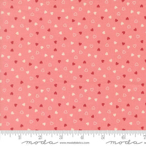 a fabric with a repeating pattern of small hearts in shades of pink and white. The pattern is spread across the fabric, creating a visually appealing and vibrant design.