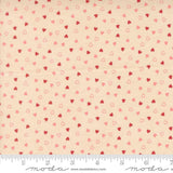 The image is a fabric with a repeating pattern of small hearts in shades of pink and red. The pattern is spread across the fabric, creating a visually appealing and textured design.