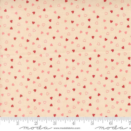 The image is a fabric with a repeating pattern of small hearts in shades of pink and red. The pattern is spread across the fabric, creating a visually appealing and textured design.