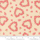a fabric with a floral pattern of hearts and flowers on a light beige background.