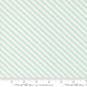 The image is a fabric with a diagonal striped pattern in shades of green and white.
