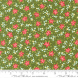 The image is a fabric with a floral pattern of red flowers and green leaves. The pattern is repeated across the fabric, creating a visually appealing and colorful design.