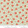 The image is a fabric with a floral pattern, featuring red flowers and green leaves. The fabric appears to be a light-colored material, possibly white or cream, with a repeating pattern of red flowers and green leaves. The image does not contain any text or additional objects, and the focus is on the floral pattern.