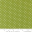 a close-up view of a fabric with a green background and white polka dots. The fabric appears to be a type of textile, possibly used for clothing or home decor.