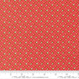a red fabric with a repeating pattern of green and white flowers or leaves. The fabric has a diagonal pattern with a grid-like design, creating a visually appealing and textured appearance.