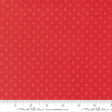 The image is a close-up of a red fabric with white polka dots, and there is a ruler for scale at the bottom of the image.
