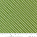 a close-up view of a fabric with a diagonal green stripe pattern. The fabric appears to be made of a material with a striped texture, and the image is described in terms of its size and the website Moda Fabrics.com.