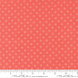 a close-up view of a fabric with a repeating pattern of small white circles against a bright red background.