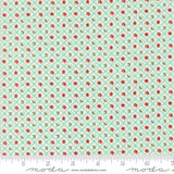 The image is a fabric with a repeating pattern of green and red flowers arranged in a diagonal grid. The pattern is composed of small red flowers interspersed with green flowers, creating a visually appealing and intricate design.