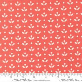a repeating pattern of white flowers on a red background.