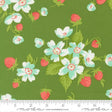 a vibrant green fabric adorned with a repeating pattern of white and red flowers, along with green leaves and red berries. The fabric appears to be a textile or fabric material, with a ruler visible in the bottom right corner for scale.