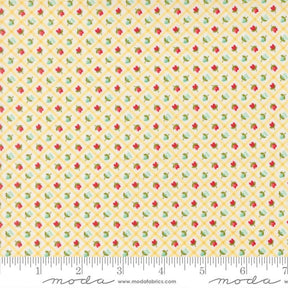 The image is a fabric with a yellow and green floral pattern, featuring small red and green flowers arranged in a diagonal grid.