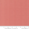 The image is a close-up of a red and white striped fabric, with a ruler for scale at the bottom.