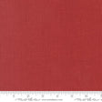 The image is a close-up of a red fabric with a ruler for scale.