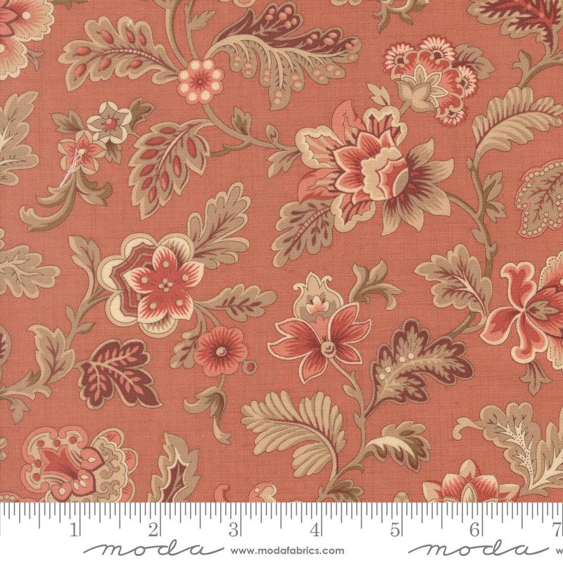The image is a close-up of a fabric with a floral pattern in shades of red, orange, and brown. The pattern features various flowers and leaves, creating a visually appealing and intricate design.