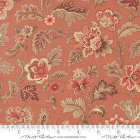The image is a close-up of a fabric with a floral pattern in shades of red, orange, and brown. The pattern features various flowers and leaves, creating a visually appealing and intricate design.