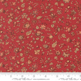 The image is a close-up of a red fabric with a floral pattern, featuring various shades of red, brown, and green flowers and leaves.