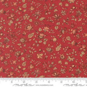 The image is a close-up of a red fabric with a floral pattern, featuring various shades of red, brown, and green flowers and leaves.