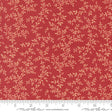 a close-up view of a fabric with a red background and a repeating pattern of small white leaves or flowers. The fabric appears to be made of a material with a floral print, and there is a ruler visible at the bottom of the image.