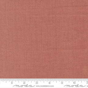 The image is a close-up of a fabric with a reddish-brown color, and it is not possible to describe the image in detail without resorting to redundancy and vague wording.