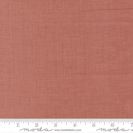 The image is a close-up of a fabric with a reddish-brown color, and it is not possible to describe the image in detail without resorting to redundancy and vague wording.
