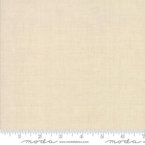 The image is a plain, light-colored fabric with a ruler for scale.