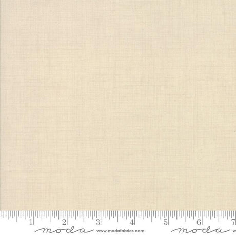 The image is a plain, light-colored fabric with a ruler for scale.