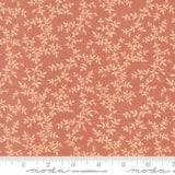 a fabric with a repeating pattern of leaves and branches in shades of orange and beige. The pattern is printed on the fabric, creating a visually appealing and textured design.
