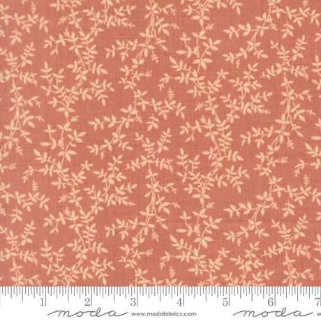 a fabric with a repeating pattern of leaves and branches in shades of orange and beige. The pattern is printed on the fabric, creating a visually appealing and textured design.