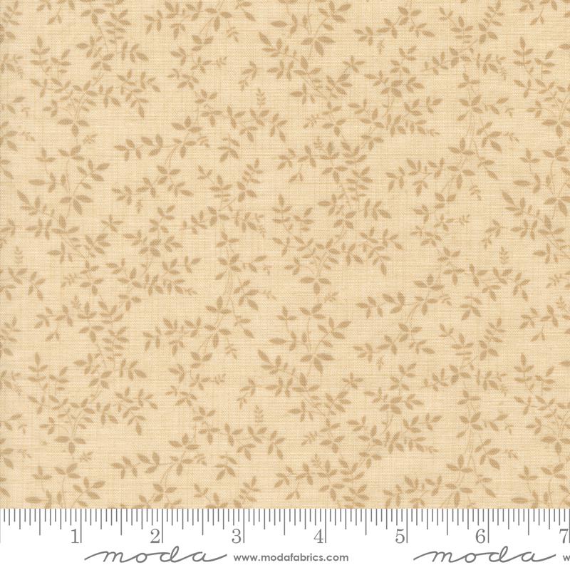 a fabric with a repeating pattern of small leaves or flowers in various shades of beige. The fabric appears to be a light-colored material, possibly a type of cotton or linen. The image does not contain any text or other discernible objects or actions.