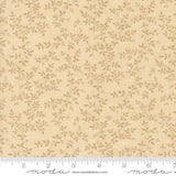 a fabric with a repeating pattern of small leaves or flowers in various shades of beige. The fabric appears to be a light-colored material, possibly a type of cotton or linen. The image does not contain any text or other discernible objects or actions.