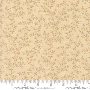 a fabric with a repeating pattern of small leaves or flowers in various shades of beige. The fabric appears to be a light-colored material, possibly a type of cotton or linen. The image does not contain any text or other discernible objects or actions.