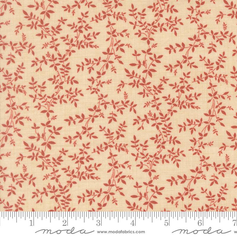 a fabric with a repeating pattern of red leaves and branches on a beige background.