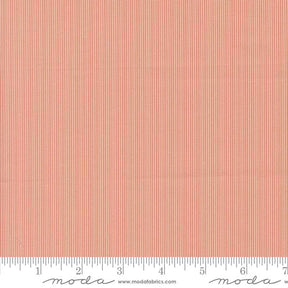 The image is a close-up of a fabric with a striped pattern in shades of orange and red.