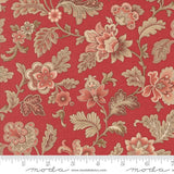 The image is a close-up of a red fabric with a floral pattern, featuring various flowers and leaves in shades of pink, red, and brown.