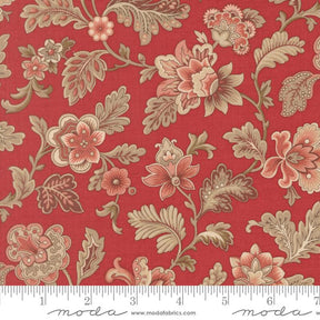 The image is a close-up of a red fabric with a floral pattern, featuring various flowers and leaves in shades of pink, red, and brown.